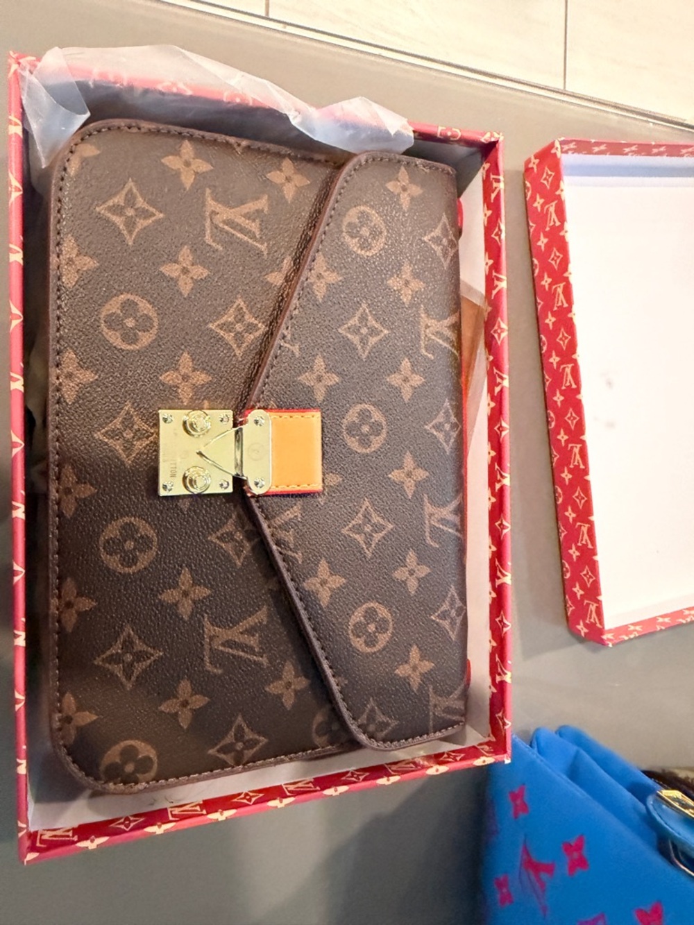 Monogram Canvas Crossbody Clutch in Brown with a strap